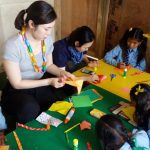 International volunteer teaching arts & crafts to the children at public shcools in nepal
