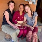 International Volunteers interacting with Community Women