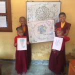 buddhist children showing art